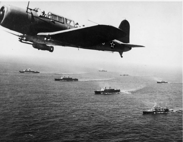 A convoy of merchant ships protected by airplanes during World War II