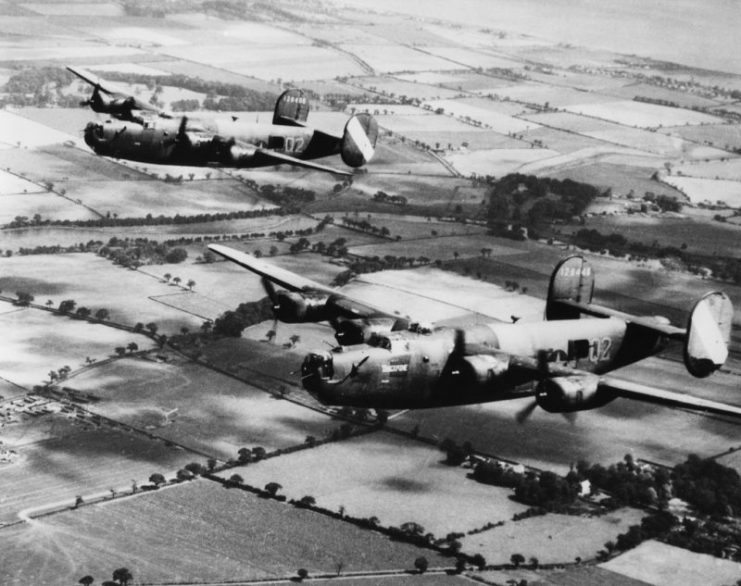 Two B-24 Liberators, (Q2-P_, serial number 41-29446) nicknamed “Tangerine” and (Q2-C_, serial number 41-29406), of the 467th Bomb Group fly together. Image via Allan Healy. IWM CC BY-NC 3.0