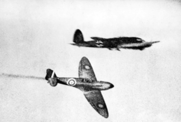 A Royal Air Force Supermarine Spitfire trails smoke after attacking a German Heinkel He 111H/P bomber during the Battle of Britain.