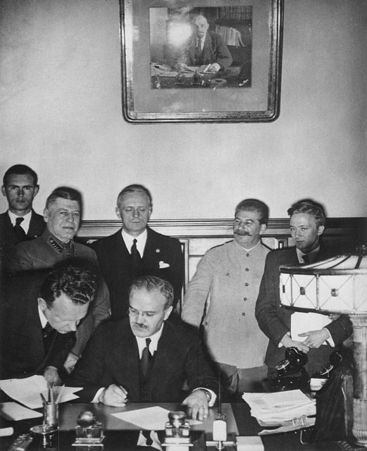 Vyacheslav Molotov signs the Molotov-Ribbentrop Pact, a German-Soviet non-aggression pact, August 23, 1939.