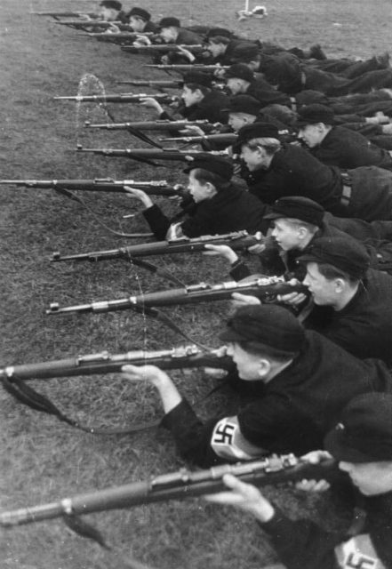 Hitler Youth at rifle practice, c. 1943. By Bundesarchiv – CC BY-SA 3.0 de