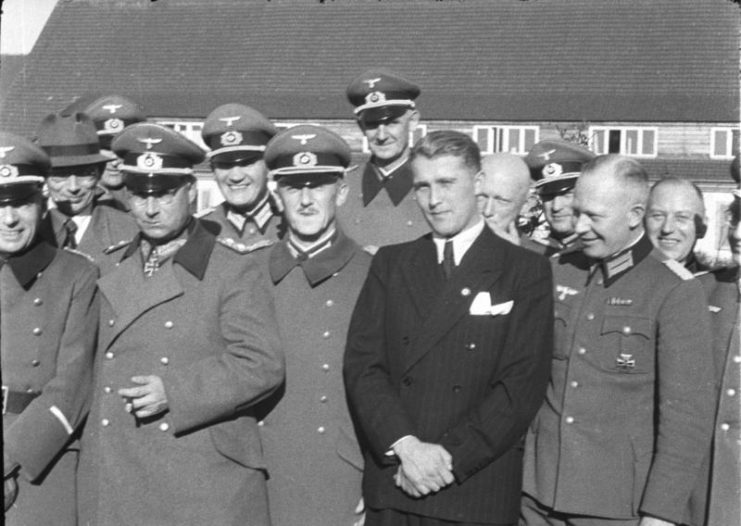 First rank, from left to right, General Dr Walter Dornberger (partially hidden), General Friedrich Olbricht (with Knight’s Cross), Major Heinz Brandt, and Wernher von Braun (in civil garment) at Peenemünde, in March 1941. Photo: Bundesarchiv, Bild 146-1978-Anh.024-03 / CC-BY-SA 3.0.