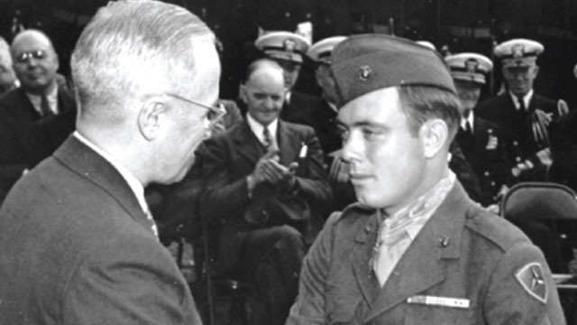 Harry Truman, president of the United States, congratulates Hershel “Woody” Williams, a Marine reservist and survivor of the battle of Iwo Jima, on being awarded the Medal of Honor for his actions during the battle of Iwo Jima during World War II October 5, 1945 at the White House in Washington. Williams is the last living Medal of Honor recepient from the battle of Iwo Jima.