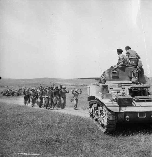 German troops surrender to British crew of a Stuart tank near Frendj, 6 May 1943.