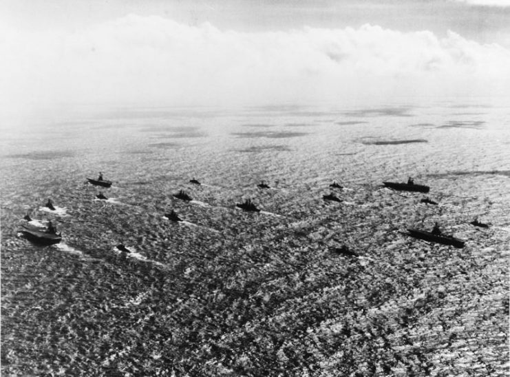 The U.S. Navy Task Force 77 steaming in formation in the South China Sea, 21 January 1966. The aircraft carriers present are (l-r): USS Kitty Hawk (CVA-63), USS Hancock (CVA-19), USS Ranger (CVA-61), USS Hornet (CVS-12). USS Oklahoma City (CLG-5) and another guided missile cruiser are in the center, with destroyers all around the column.