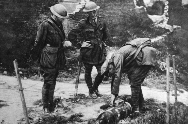 A British NCO prepares to dispose of an unexploded bomb during the First World War.