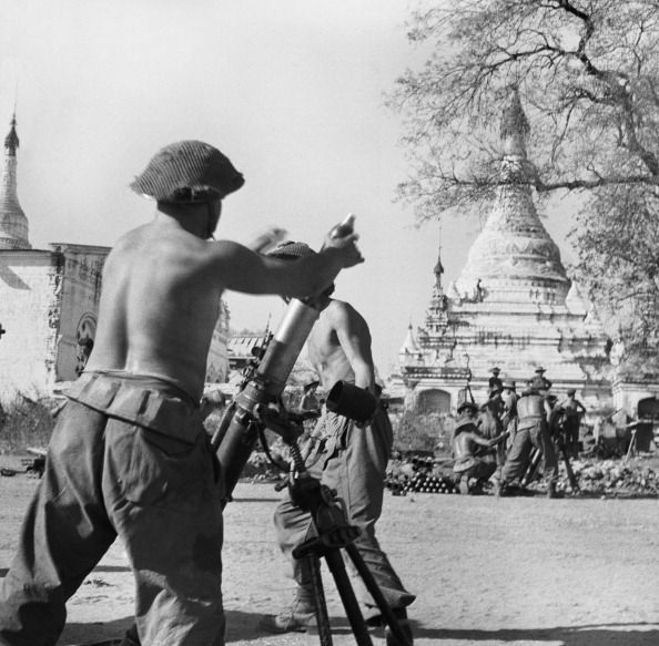 British soldiers in action with a 3-inch mortar in Mandalay, 28th February 1945.