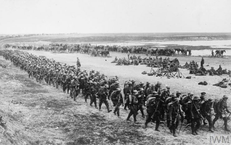 German troops marching along the bank of the River Vistula, Poland. IWM (Q 55050)