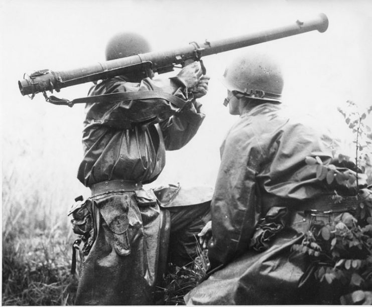 A team mans a Bazooka at the Battle of Osan. Members of the 24th Infantry Division, first United States ground units to reach the front, go into action against North Korean forces at the village of Sojong-Ni, near Osan. At right is Private First Class Kenneth Shadrick, who was killed by enemy fire a few moments after this photo was made, thus becoming the first United States soldier to die in the Korean campaign.