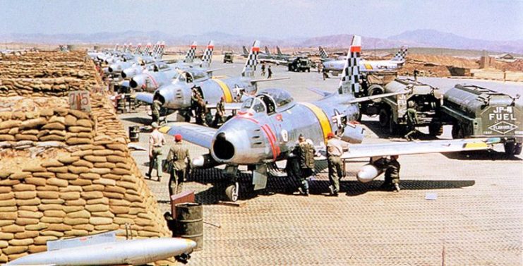 United States Air Force North American F-86 Sabre fighters from the 51st Fighter Interceptor Wing Checkertails are readied for combat during the Korean War at Suwon Air Base