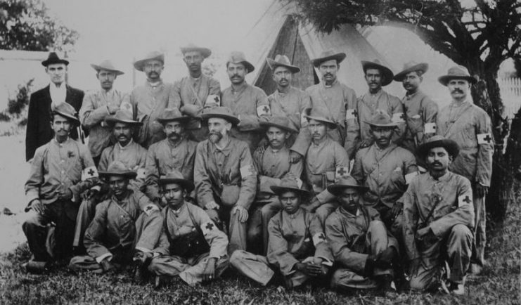 Stretcher-bearers of the Indian Ambulance Corps during the war, including the future leader of India, Mohandas Karamchand Gandhi (Middle row, 5th from left).