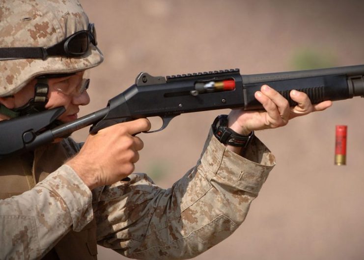 A U.S. Marine fires a Benelli M4 shotgun during training in Arta, Djibouti, 23 December 2006.