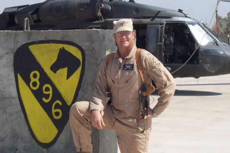 Muenks is pictured in front of his UH-60 “Blackhawk” helicopter on Taji, Airfield in Taji, Iraq, in 2004. During the deployment, the pilot was briefly attached to 2nd Battalion, 227th Aviation Regiment. Courtesy of Pat Muenks