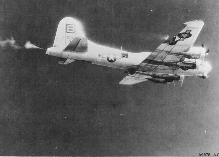“The Thomper” (coded BG-X) B-17G-55-BO Flying Fortress s/n 42-102560 334th BS, 95th BG, 8th AF lost on the November 30, 1944, mission to Merseburg, Germany. 5 KIA, 4 POW MACR 10840. In the photo the plane is under attack by German fighters and the tail gunner is returning fire. Note the damage to the right wing and wisps of fire starting to show.