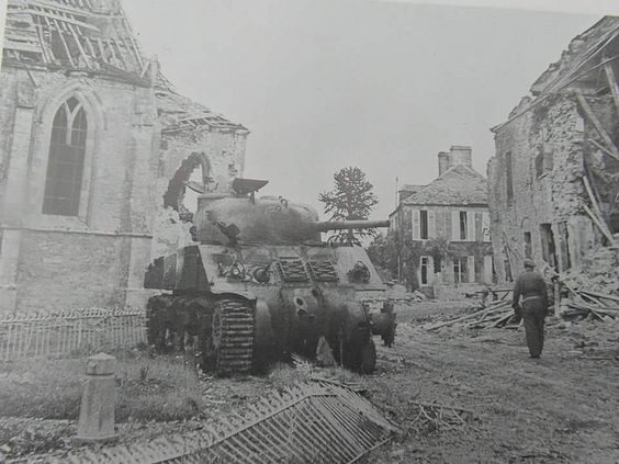A knocked-out Sherman tank in the centre of Lingèvres, 20 June 1944