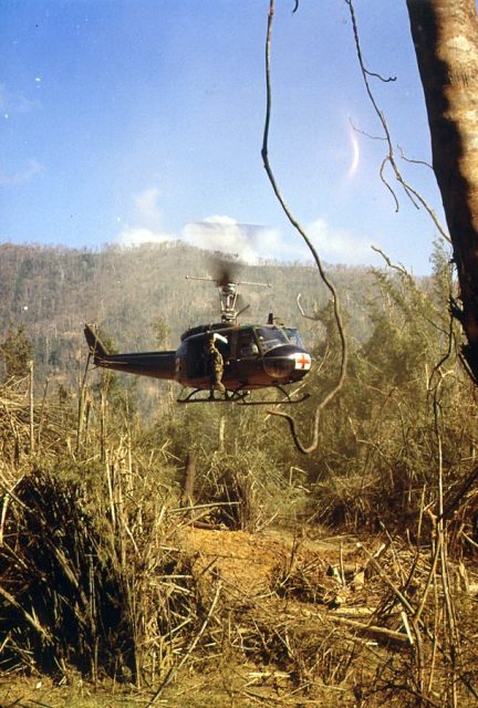 A UH-1D Medevac helicopter takes off to pick up an injured member of the 101st Airborne Division, near the demilitarized zone, South Vietnam, 1969.