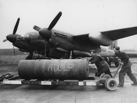 ‘Happy Xmas Adolf’ – ground staff ‘bombing up’ Mosquito Mk XVI MM199 of No. 128 Squadron, No. 8 (PFF) Group, at Wyton with a 4,000 lb ‘Cookie’. This aircraft was shot down by flak and crashed near the village of Benthe while on an operation to Hanover on the night of 4/5 February 1945. Lt Lt J K Wood and Fg Off R Poole were both killed.