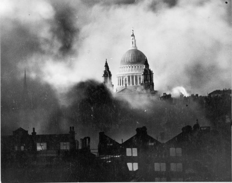 St Paul’s Cathedral, rising above the bombed London skyline, is shrouded in smoke during the Blitz. The photograph was taken from the roof of the Daily Mail offices in Fleet Street.