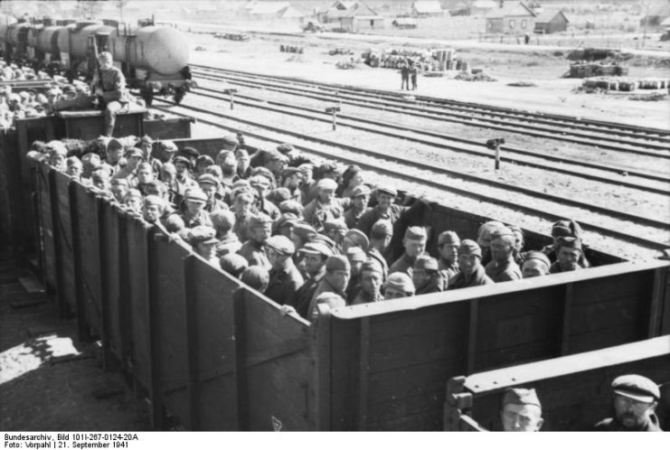Soviet POWs transported in an open wagon train. September 1941. By Bundesarchiv – CC BY-SA 3.0 de