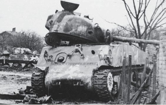 A pair of M4A3s of the 12th Armored Division following the fighting in Herrlisheim. Most of the 43rd Tank Battalion was knocked out in this battle