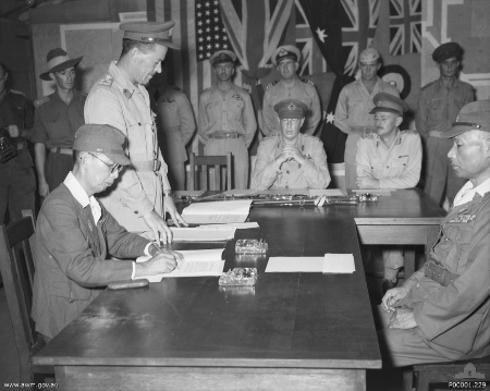 Masatane Kanda signs the instrument of surrender of Japanese forces on Bougainville Island, New Guinea, 8 September 1945.