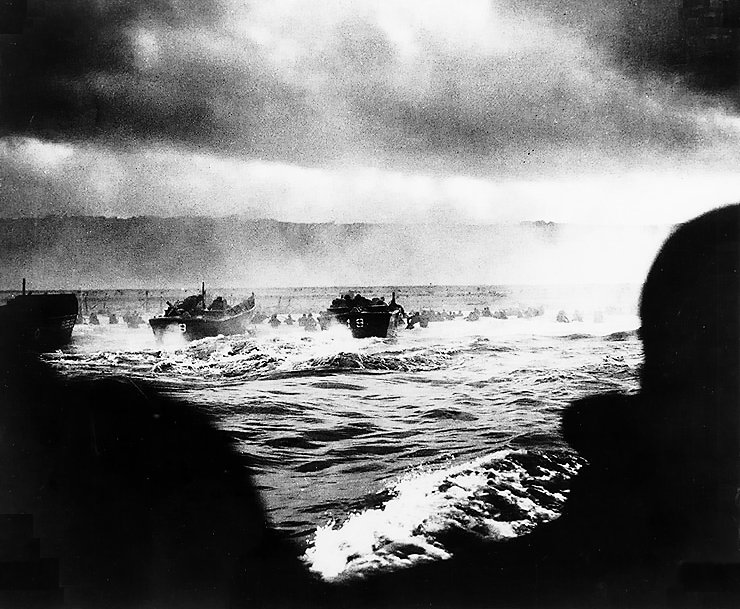 LCVP landing craft put troops ashore on “Omaha” Beach on “D-Day”, 6 June 1944. The LCVP at far left is from USS Samuel Chase (APA-26).