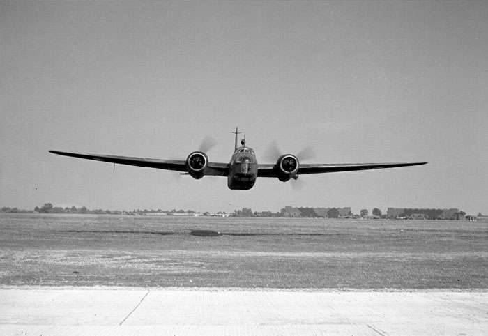A Vickers Wellington I medium bomber is about to scare the bejeesus out of this RAF photographer at RAF Bassingbourn, in 1940