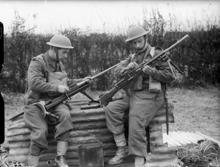 Troops from the 1st Border Regiment at Rumegies cleaning a Boys anti-tank rifle and a Bren gun, 29 February 1940.