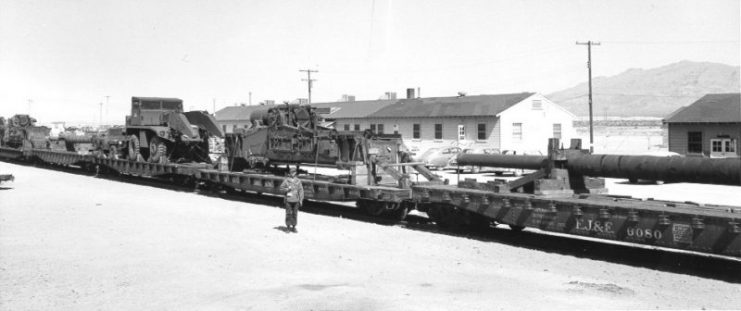 The weapon when assembled is 84 long, 10 feet wide. Eight flat cars were required to transport the components. Nellis Air Force Base, 1953.