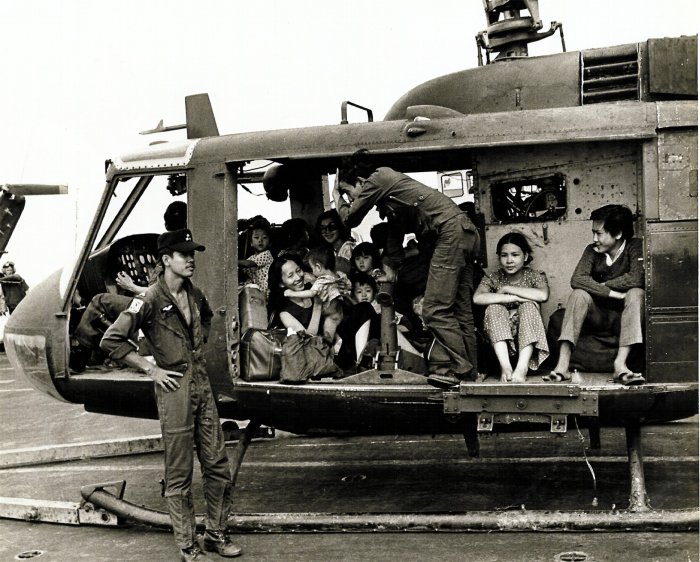 A VNAF UH-1H Huey loaded with Vietnamese evacuees on the deck of the U.S. aircraft carrier USS Midway (CV-41) during Operation Frequent Wind, 29 April 1975.
