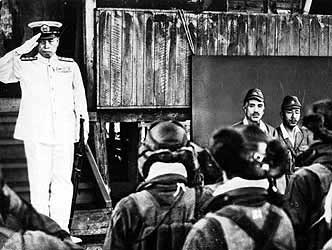 Admiral Yamamoto, a few hours before his death, saluting Japanese naval pilots at Rabaul, April 18, 1943