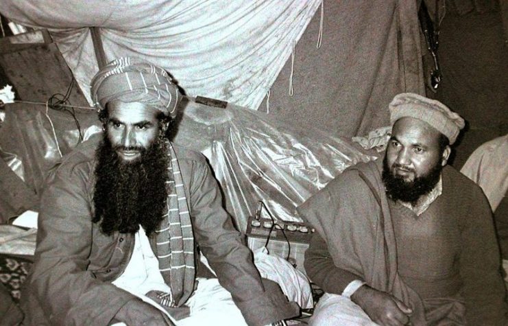 This is a photo of Abdul Rasul Sayyaf of Afghanistan (left) with one of his top lieutenants, Commander Abdullah. Picture taken in Jaji, Paktia Province, Afghanistan on 30 August 1984.