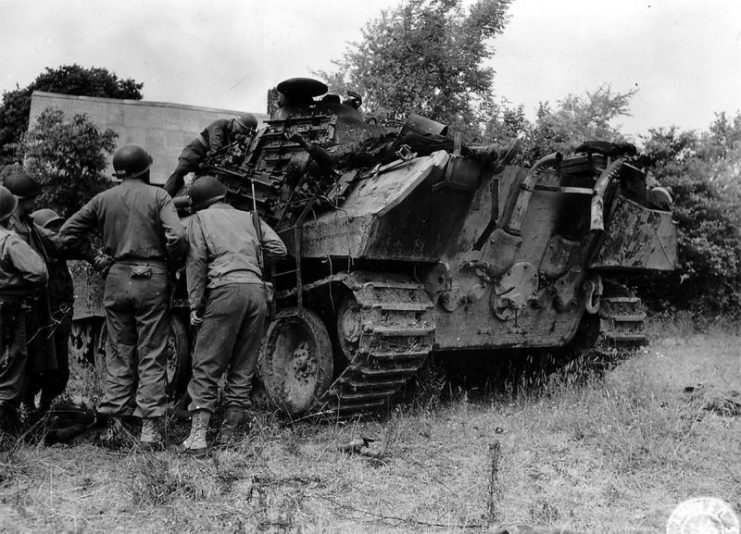 Battle of Normandy: US soldiers inspect the wreckage of a German Panther tank.