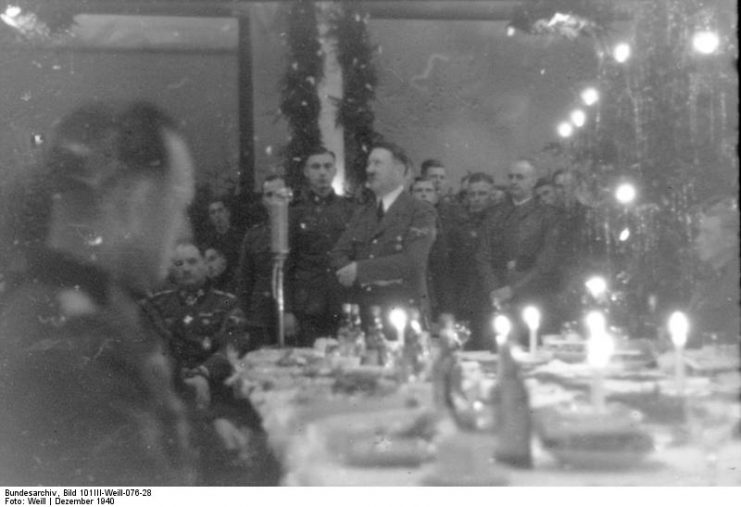 Adolf Hitler during Christmas dinner. Photo: Bundesarchiv, Bild 101III-Weill-076-28 / Weill / CC-BY-SA 3.0.