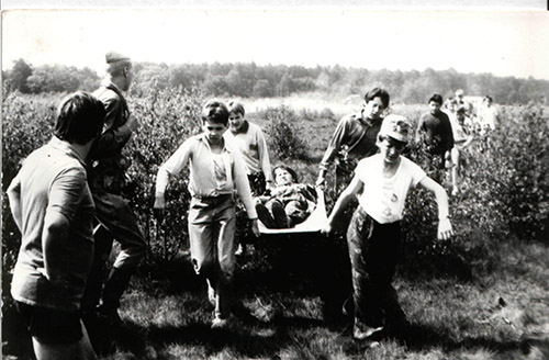 Children practice evacuating a “wounded” soldier during Zarnitsa Games.