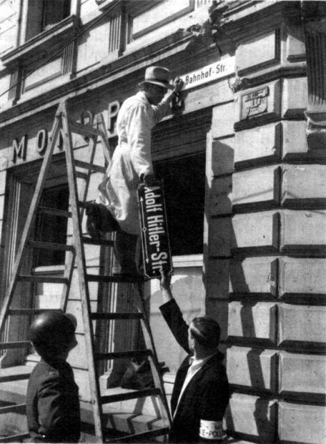 Workers removing the signage from a former “Adolf Hitler Strasse” (street) in Trier, May 1945