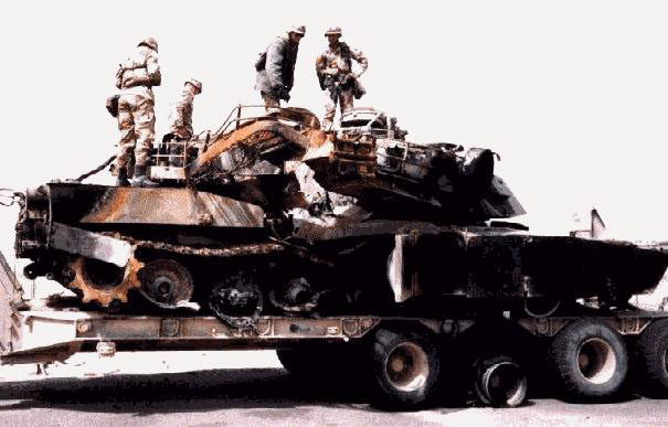 A destroyed M1A1, lost to friendly fire, hit in rear grill by Hellfire missile and penetrated by sabot tank round from left side to right (see exit hole)