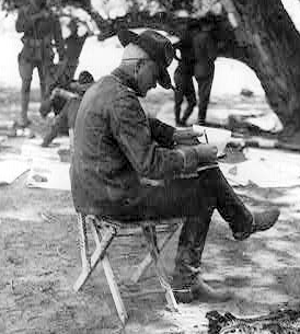 General John J. Pershing in his camp at Colonia Dublán, studying telegraphed orders.
