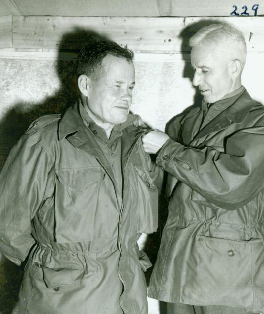 General Smith pinning Brigadier stars on General Puller, just promoted. By USMC Archives – CC BY 2.0
