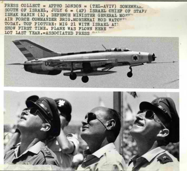 Chief of Staff Yitzhak Rabin, Defense Minister Moshe Dayan and Air Force Commander Mordechai Hod are watching an aerial display in which the MiG 21 was first introduced.