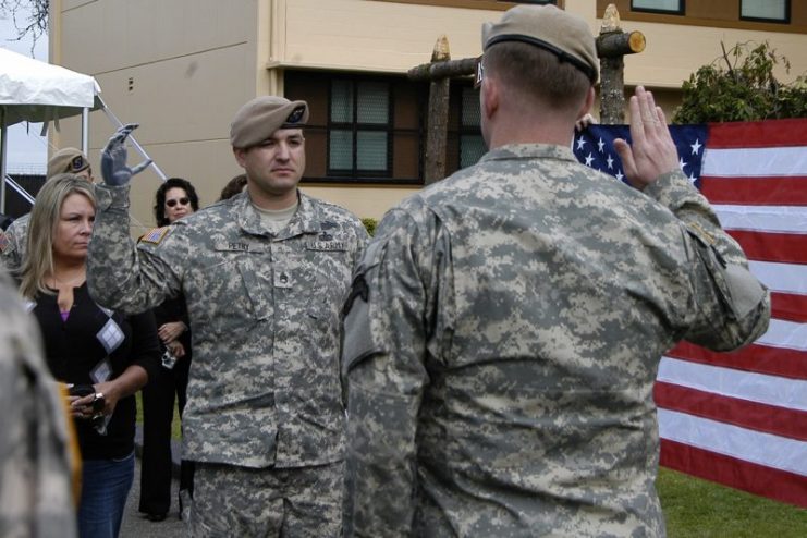 Petry re-enlists in the U.S. Army at Fort Lewis, Washington, in May 2010.