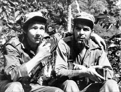 Raúl Castro (left), with his arm around his second-in-command, Ernesto “Che” Guevara, in their Sierra de Cristal mountain stronghold in Oriente Province, Cuba, in 1958