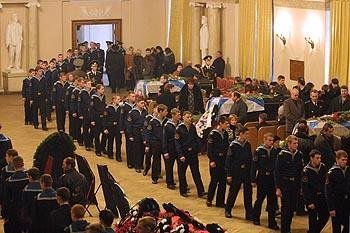 Sailors pass the coffins during the Kursk Memorial.