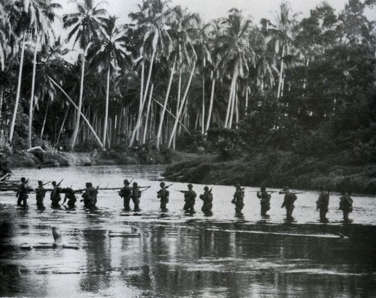 A U.S. Marine patrol crosses the Matanikau River in Guadalcanal in September 1942