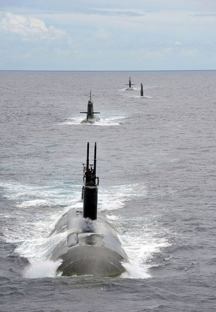 The Los Angeles class fast attack submarine USS Charlotte (SSN 766) steams in a close formation with submarines from RimP of the Pacific (RIMPAC) Exercise 2014.