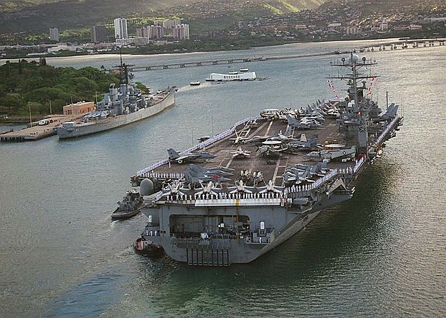 USS Carl Vinson enters Pearl Harbor with CVW-11 aboard with USS Missouri in background