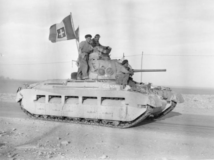A British Matilda tank on its way into Tobruk, displaying an Italian flag, 24 January 1941.
