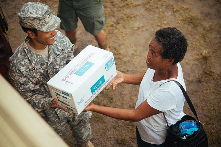 A civilian thanks Army National Guard Soldiers for handing out food and water in St. John on Sept. 15, 2017.