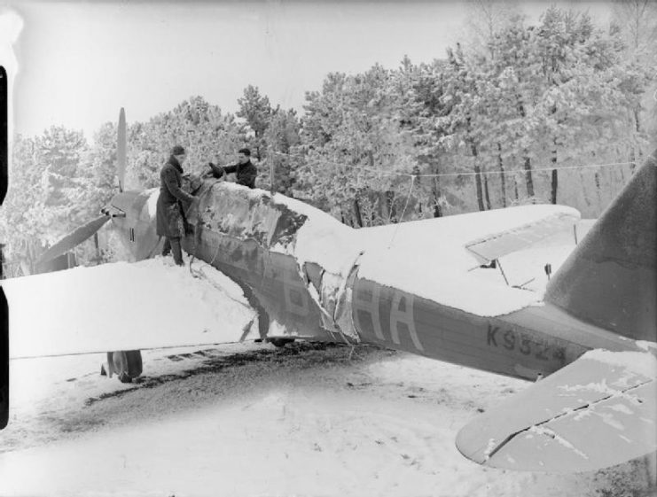 A mechanic at work on a snow covered Fairey Battle fighter bomber during the winter of 1939 -1940.