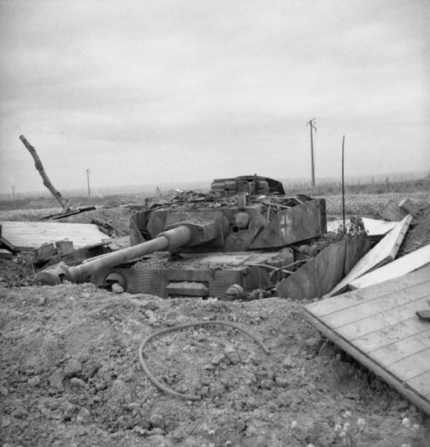 A Panzer IV of the 1/22nd Panzer Regiment in a dug-in defensive position, photographed near Lébisey
